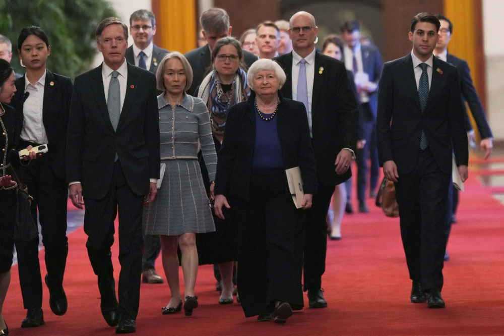 US Treasury Secretary Janet Yellen walks with US ambassador to China Nicholas Burns to attend a meeting with Chinese Premier Li Qiang at the Great Hall of the People in Beijing, China, April 7, 2024. — Reuters pic